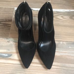 Black suede heels with gold zipper